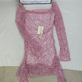 A slimming, soft pink, figure-hugging dress