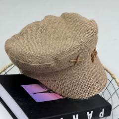Woven straw cap with a flat top