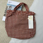 Small Red Handbag With A Checkered Pattern