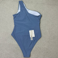 Solid-color irregularly perforated bikini