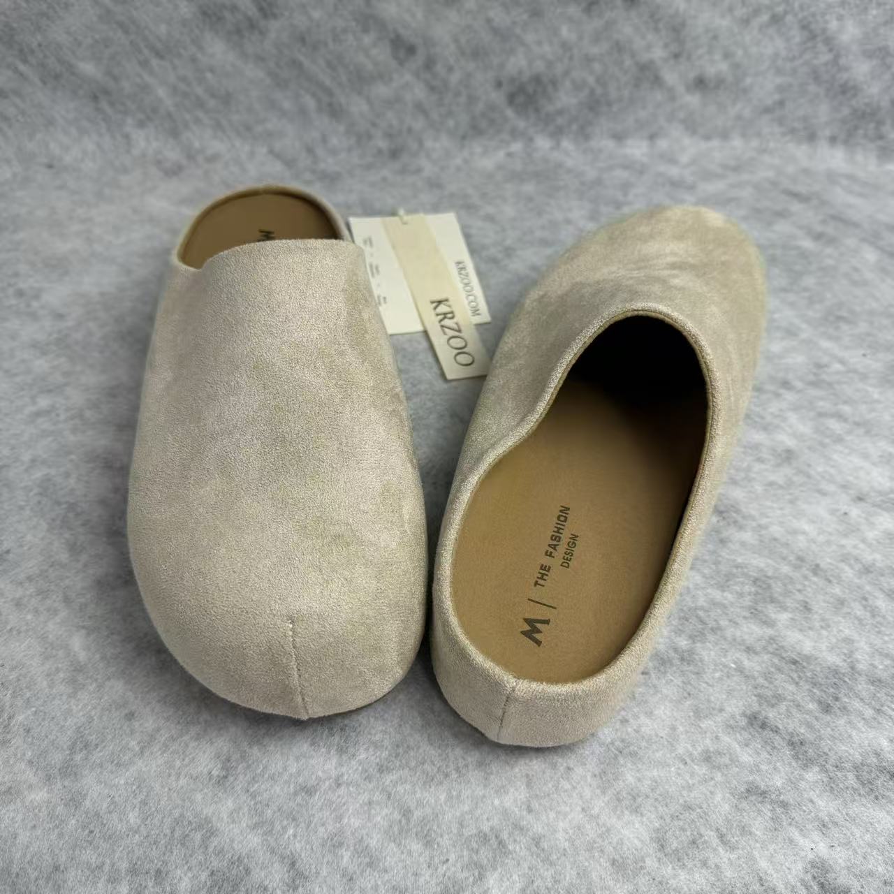 One foot wearing a thick-soled baghdad-style shoe