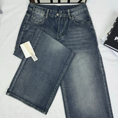 Washed and distressed denim pants