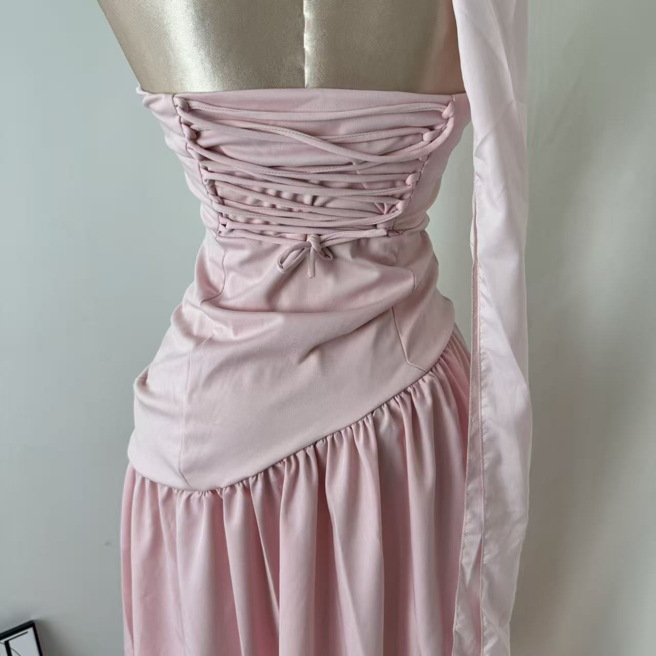 Pink-belted strapless dress