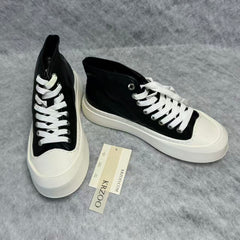 High-top black and white canvas shoes with thick soles
