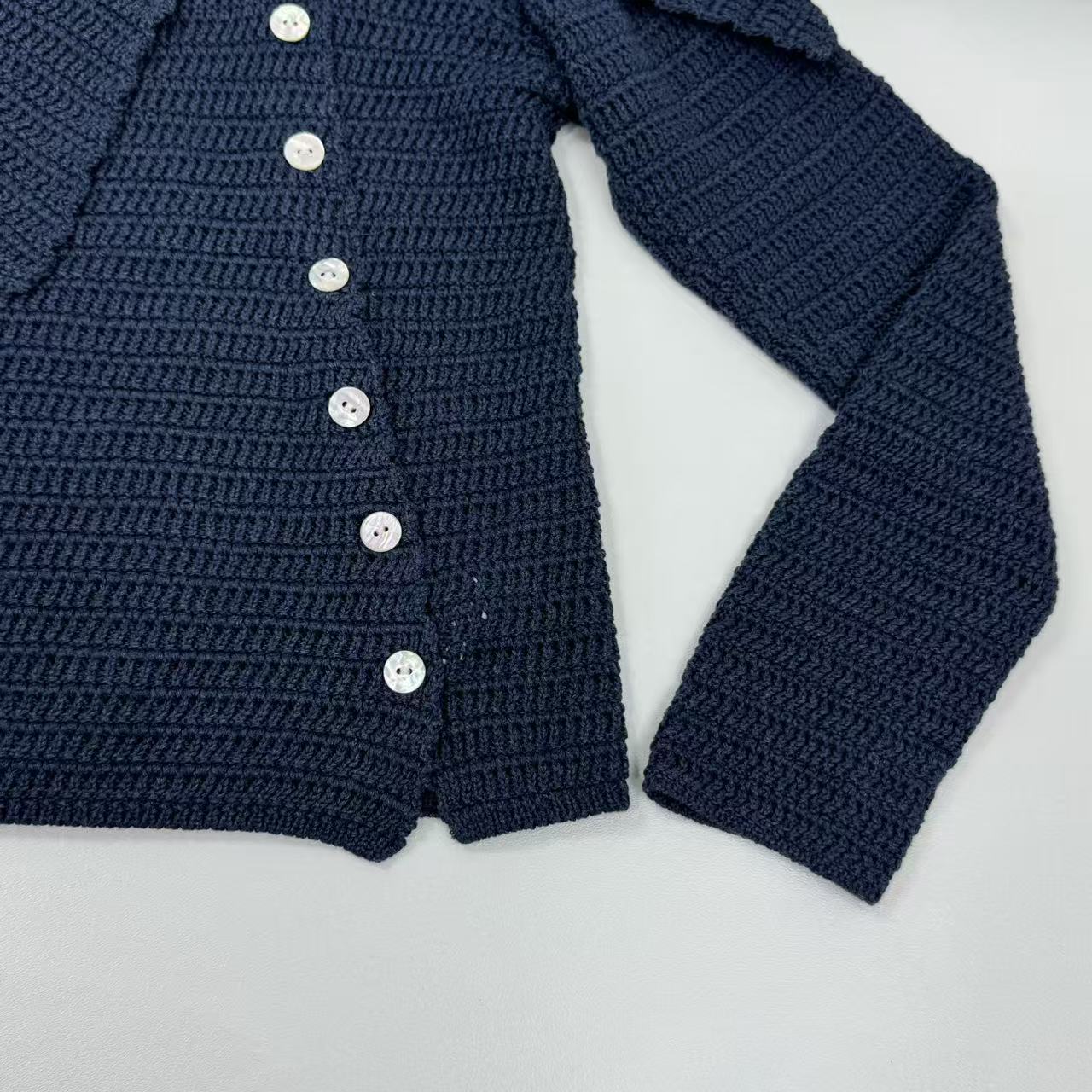 Asymmetric long-sleeved V-neck knitted top