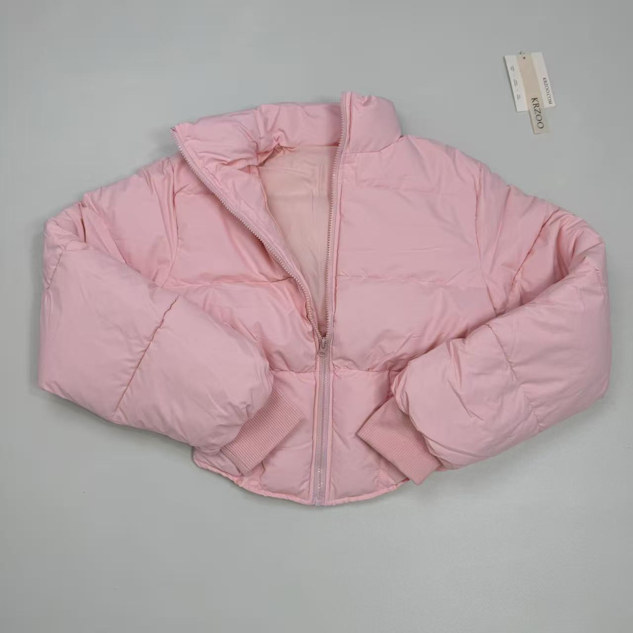 A slim-fitting short coat with a stand-up collar