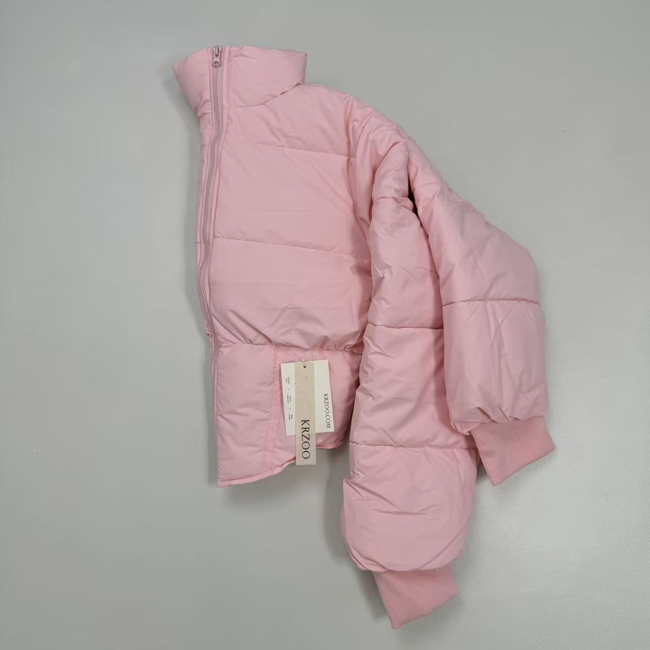 A slim-fitting short coat with a stand-up collar