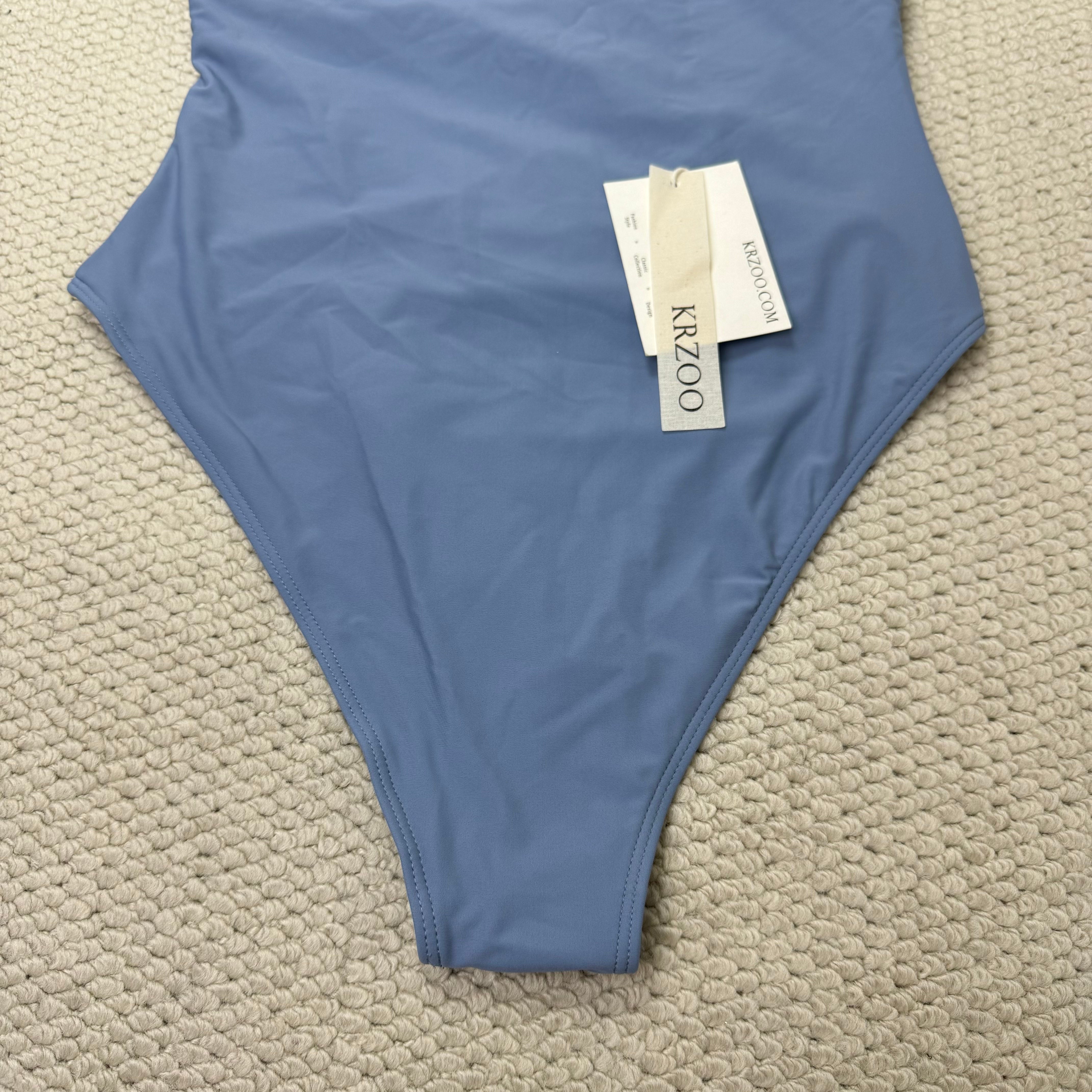 Solid-color irregularly perforated bikini