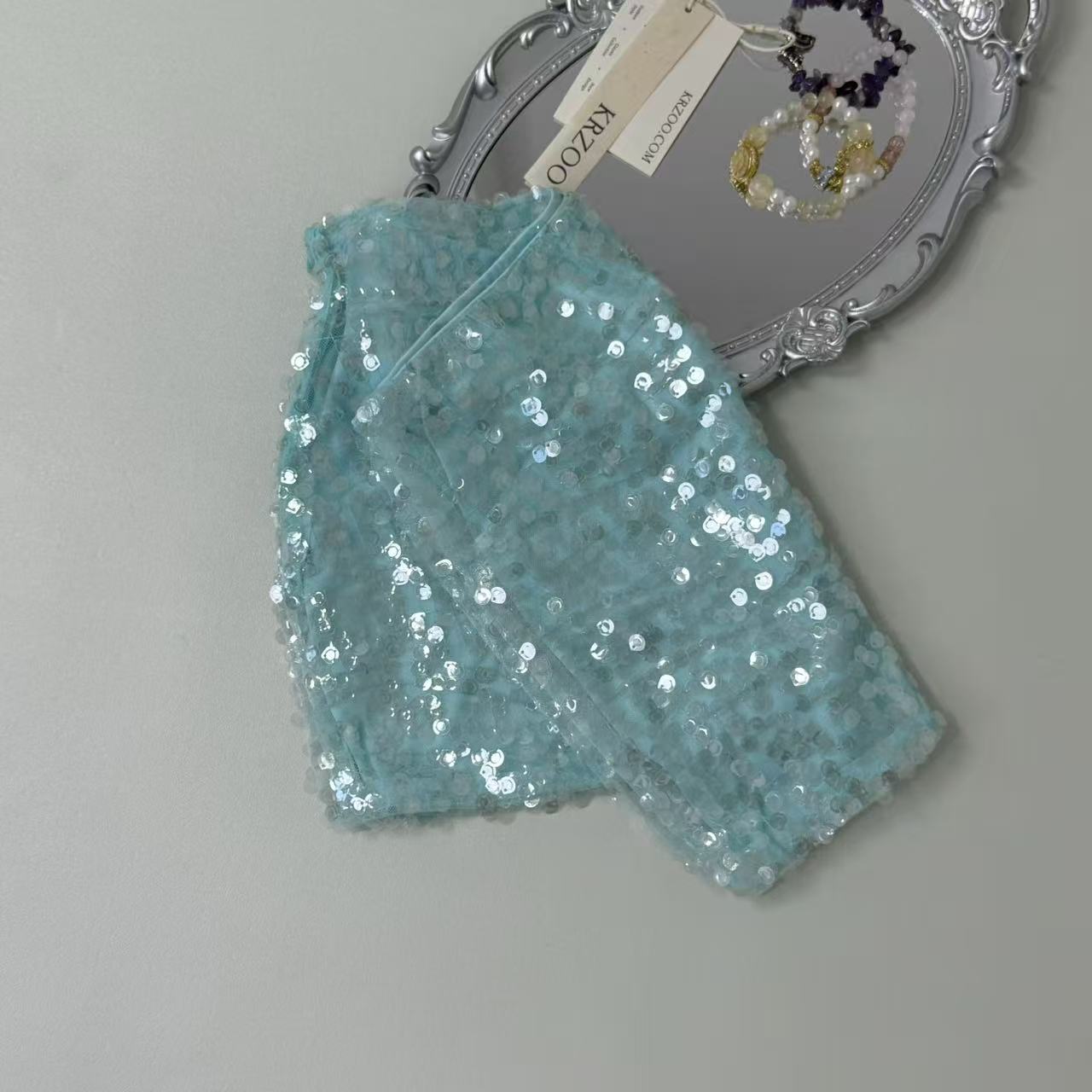 A figure-hugging midriff-baring half-length skirt