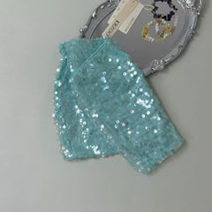 A figure-hugging midriff-baring half-length skirt