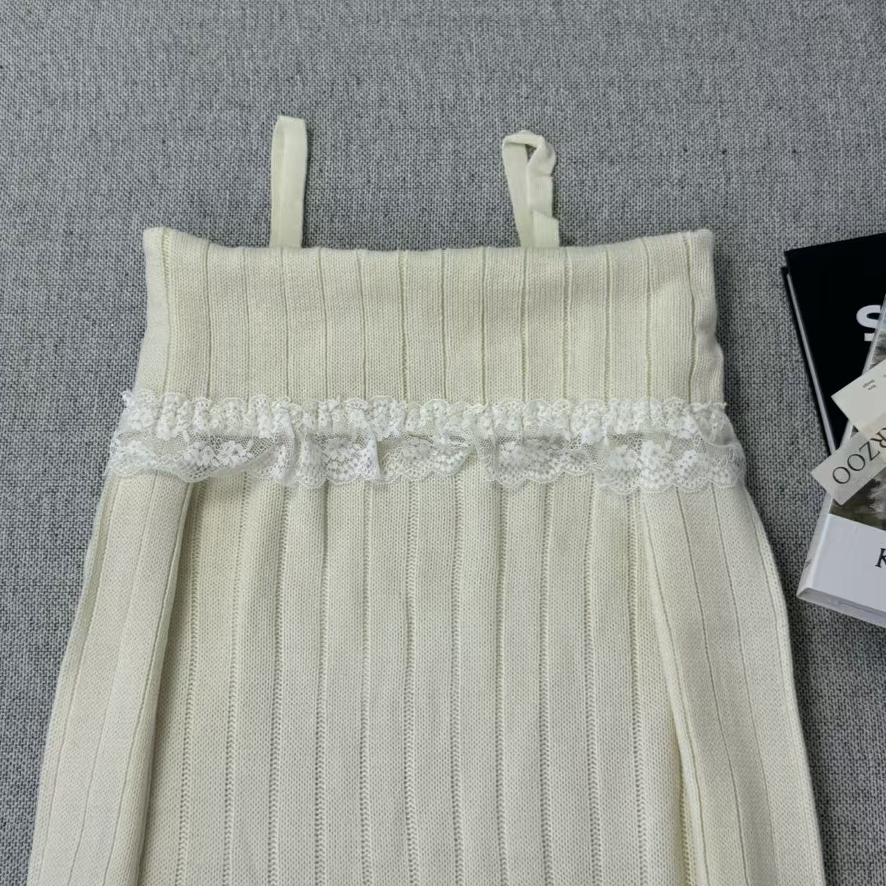 Lace trimmed one-shoulder sweater