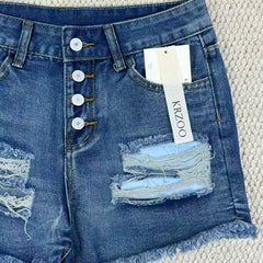 Hole-rimmed fringed denim shorts