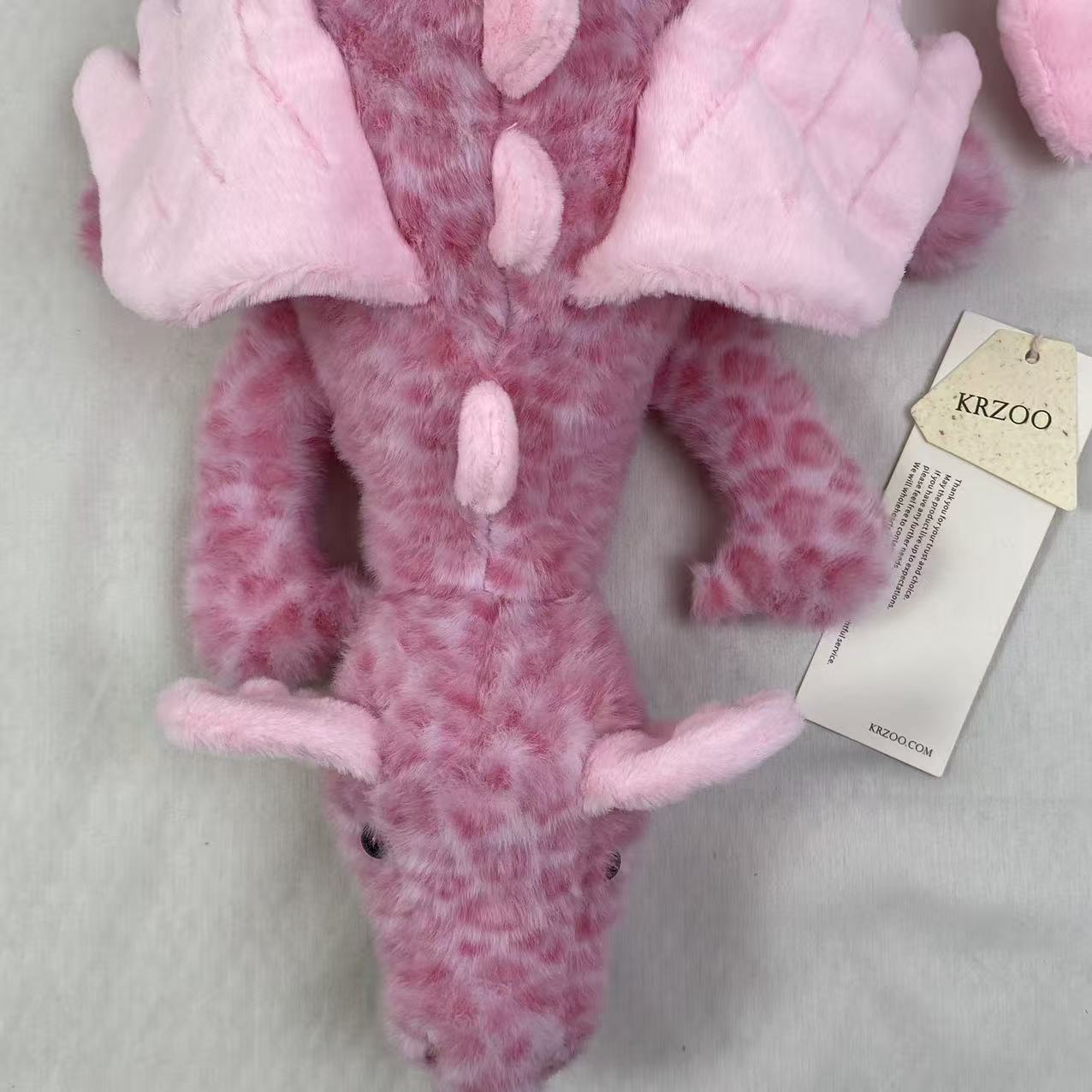 Pink little dragon doll