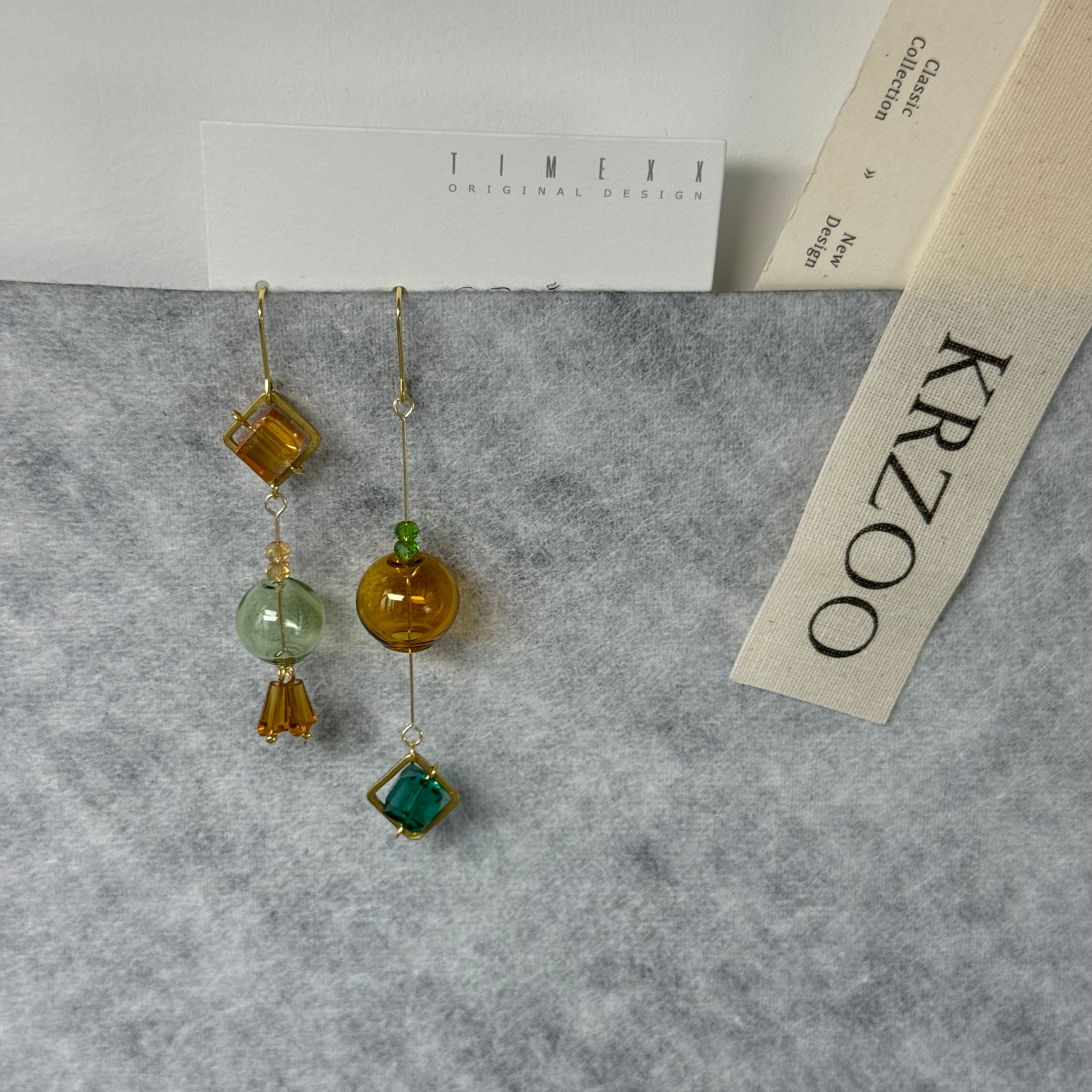 T glass ball asymmetrical long green earrings