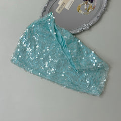 A figure-hugging midriff-baring half-length skirt