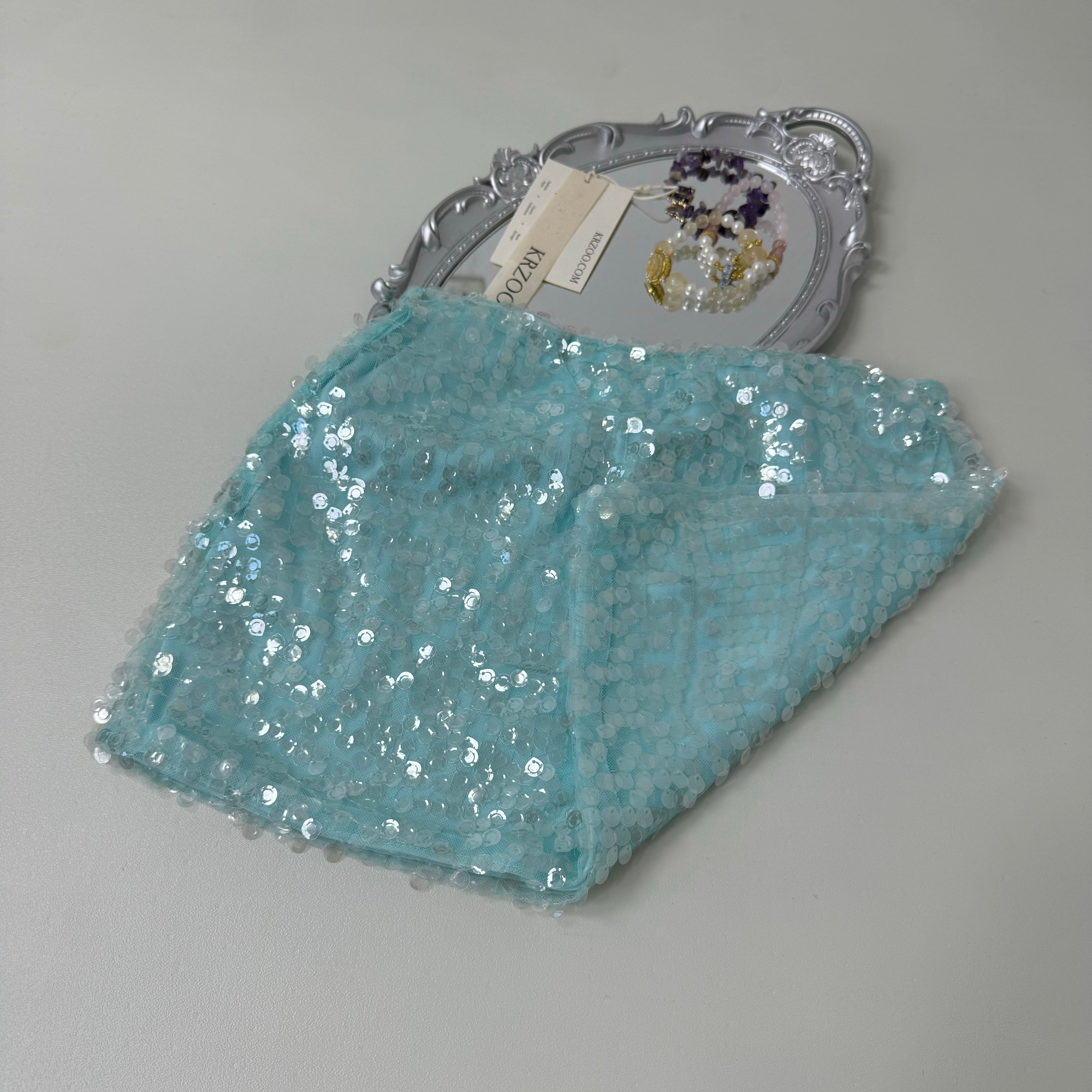 A figure-hugging midriff-baring half-length skirt