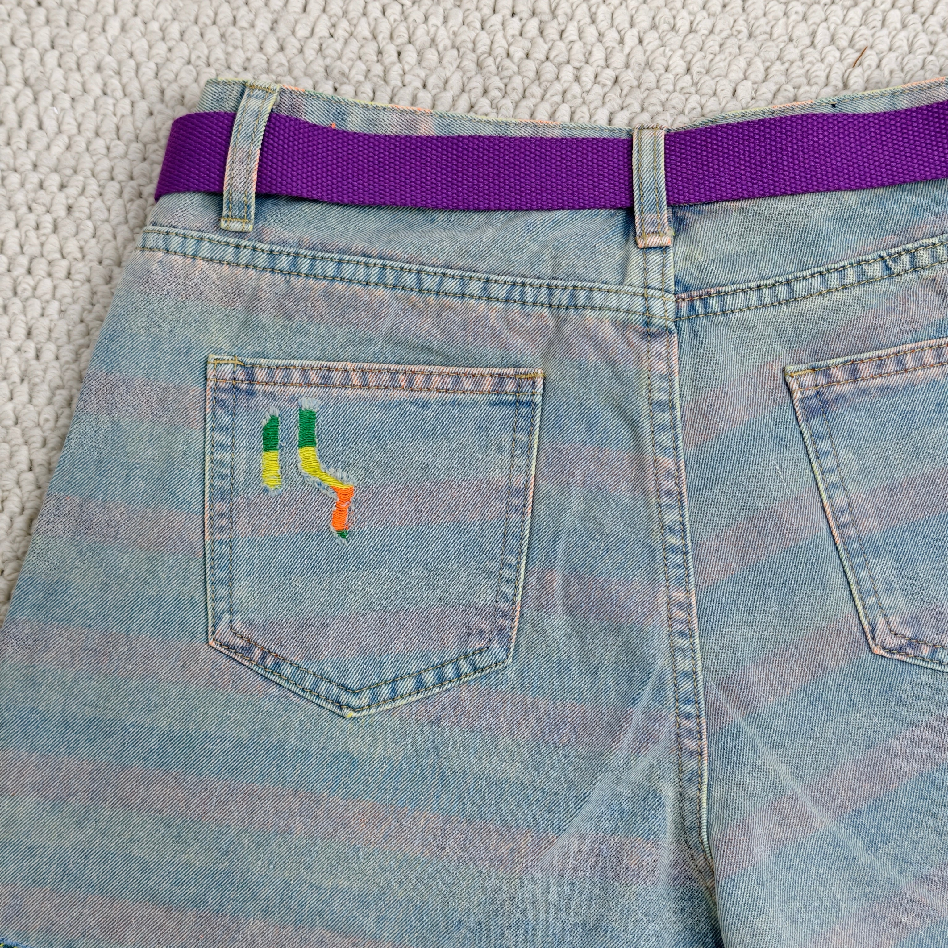 Striped holey denim shorts