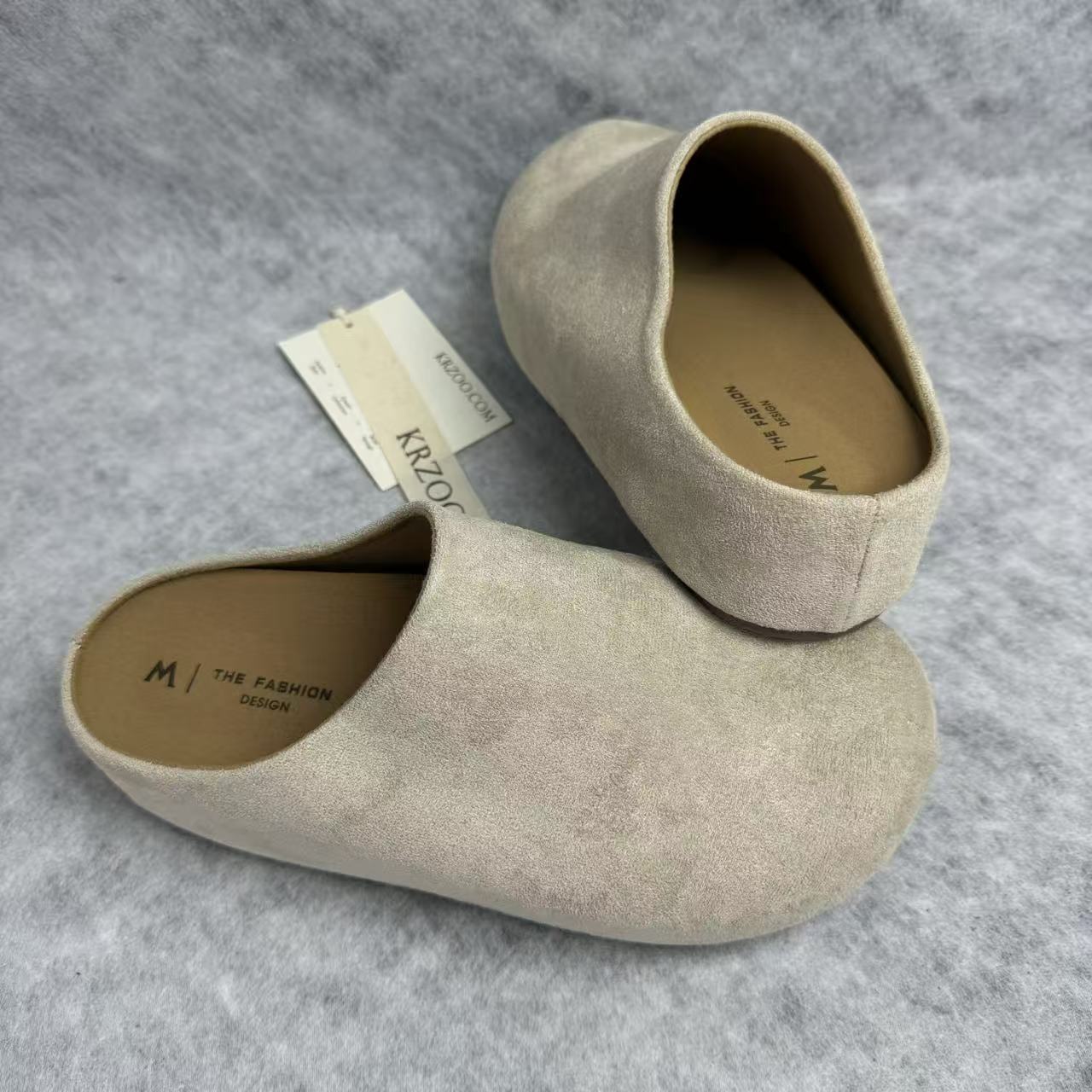 One foot wearing a thick-soled baghdad-style shoe