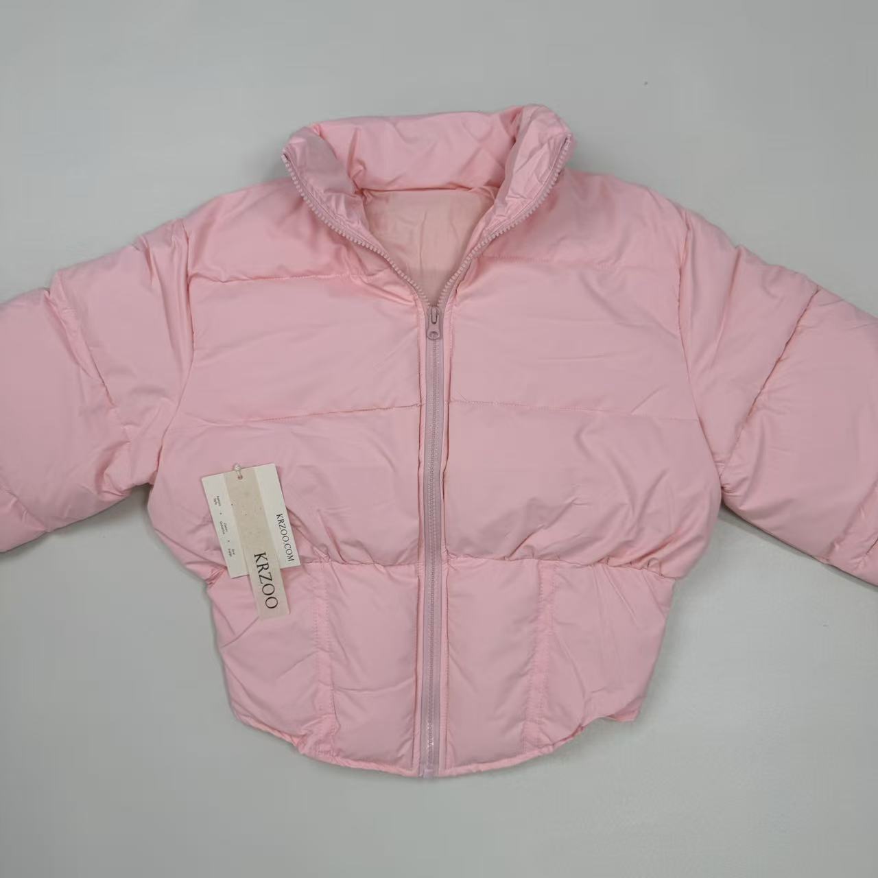 A slim-fitting short coat with a stand-up collar