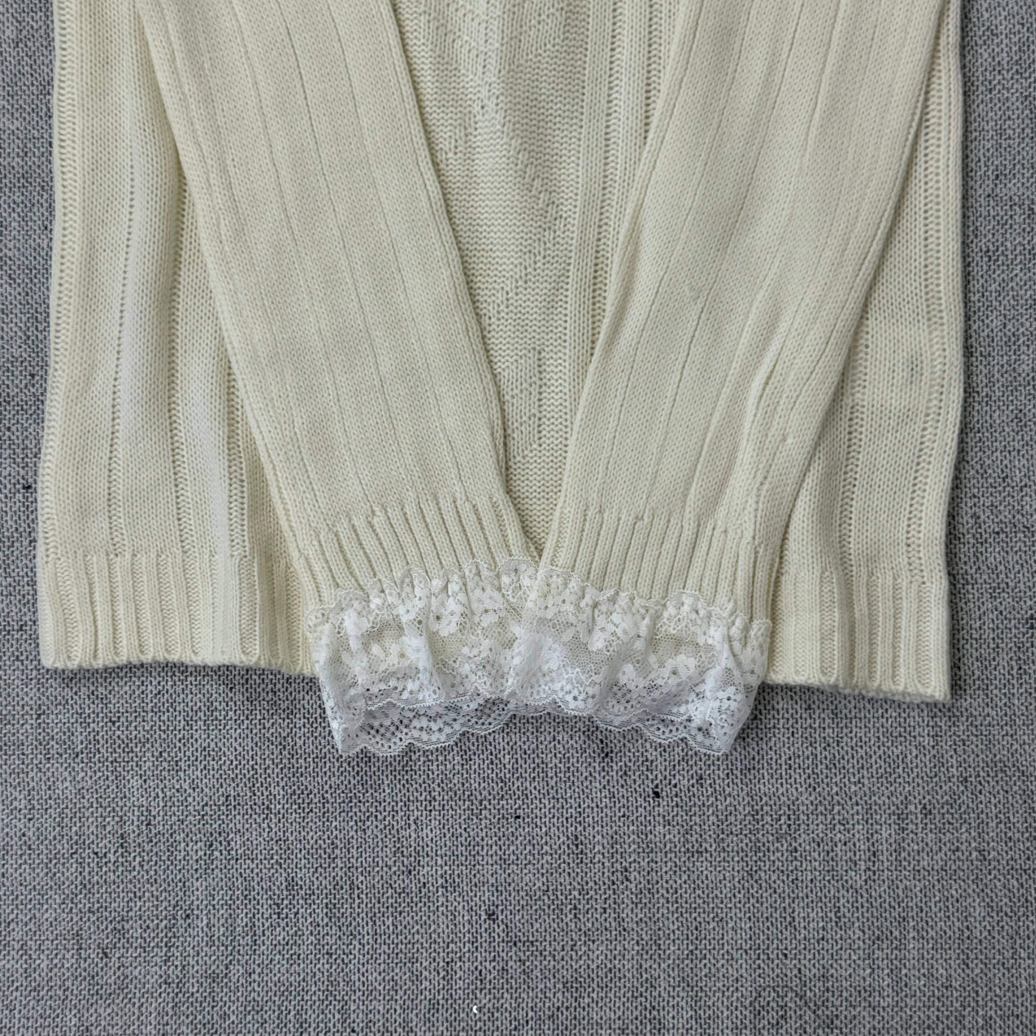 Lace trimmed one-shoulder sweater