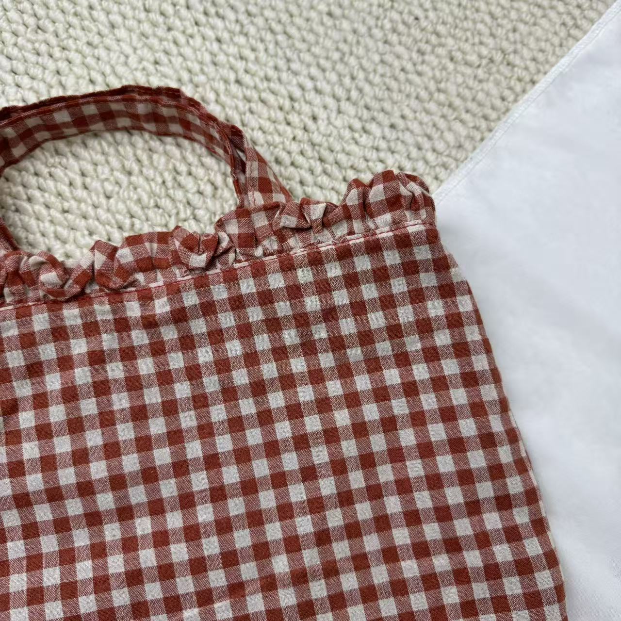 Small Red Handbag With A Checkered Pattern
