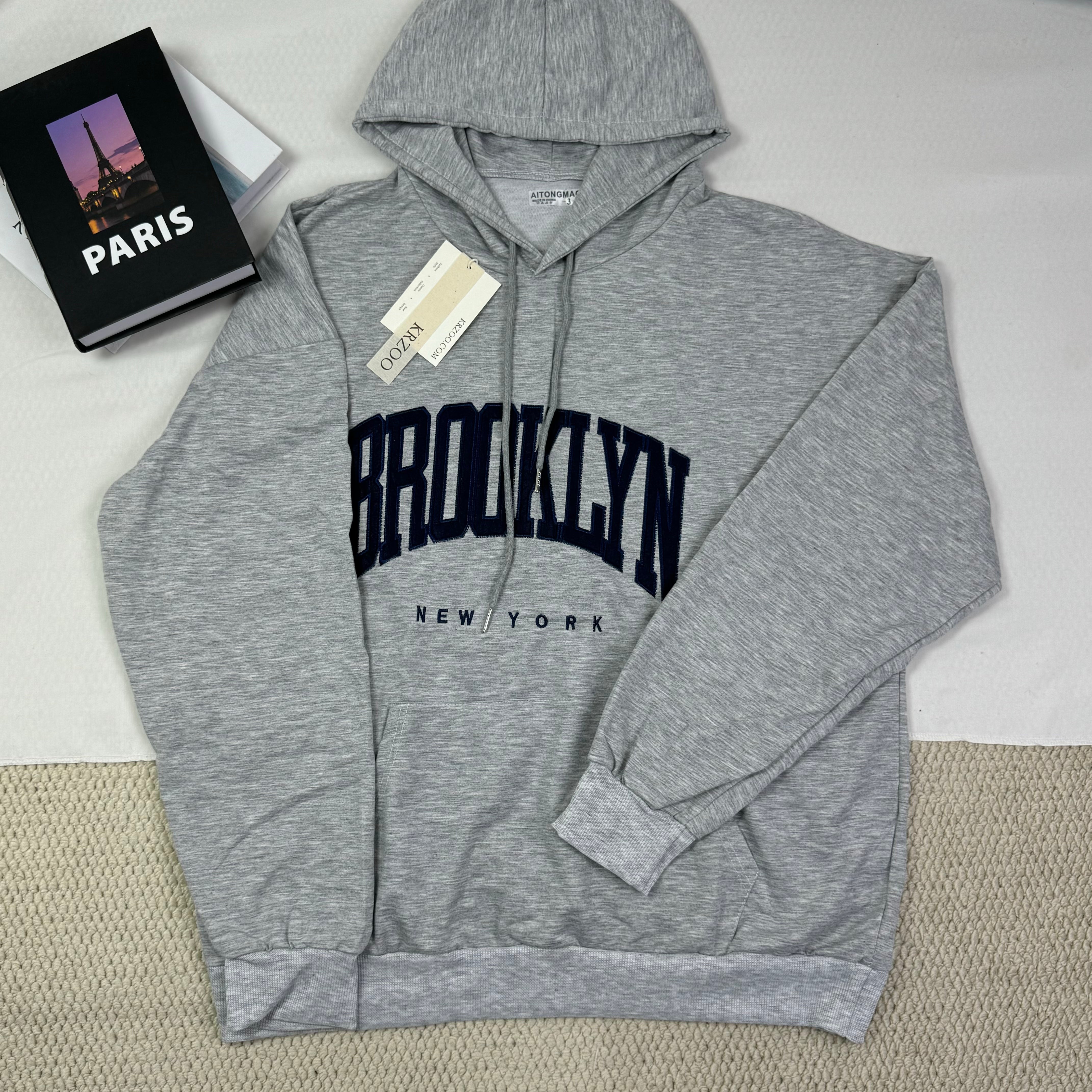 Hooded sweatshirt is loose