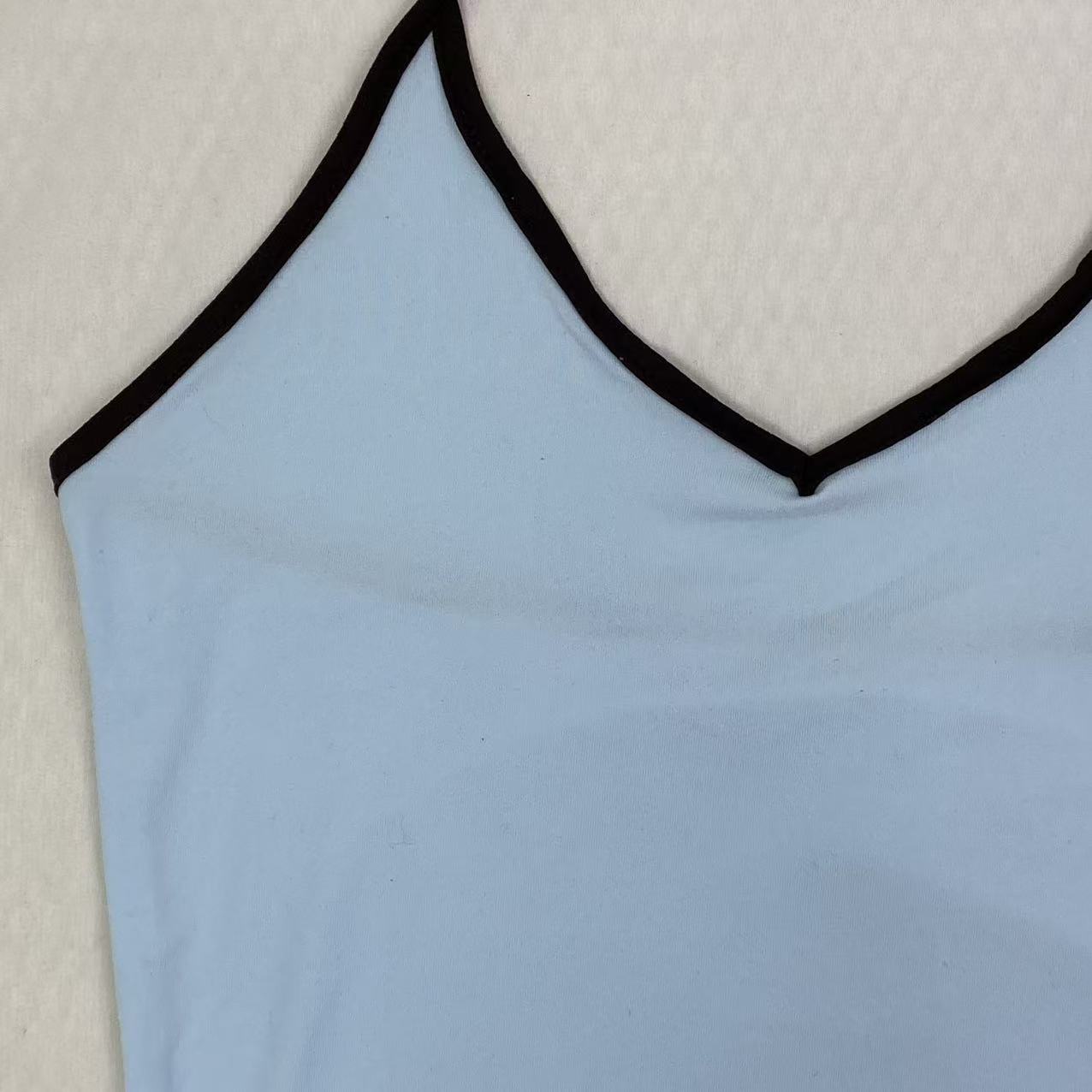 Contrasting color tie-neck sling-neck top