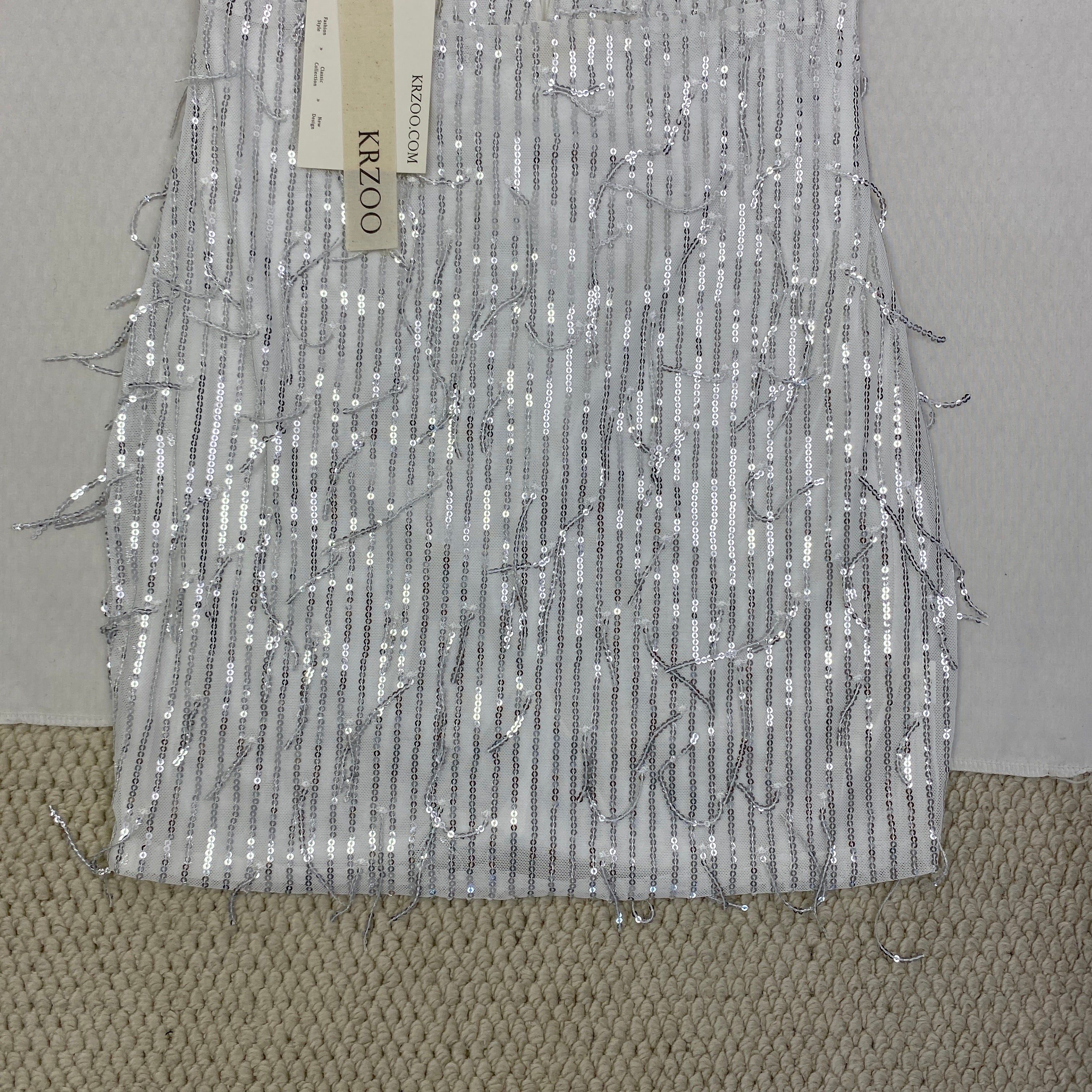 Deep V silhouette fringed halter dress with sequins