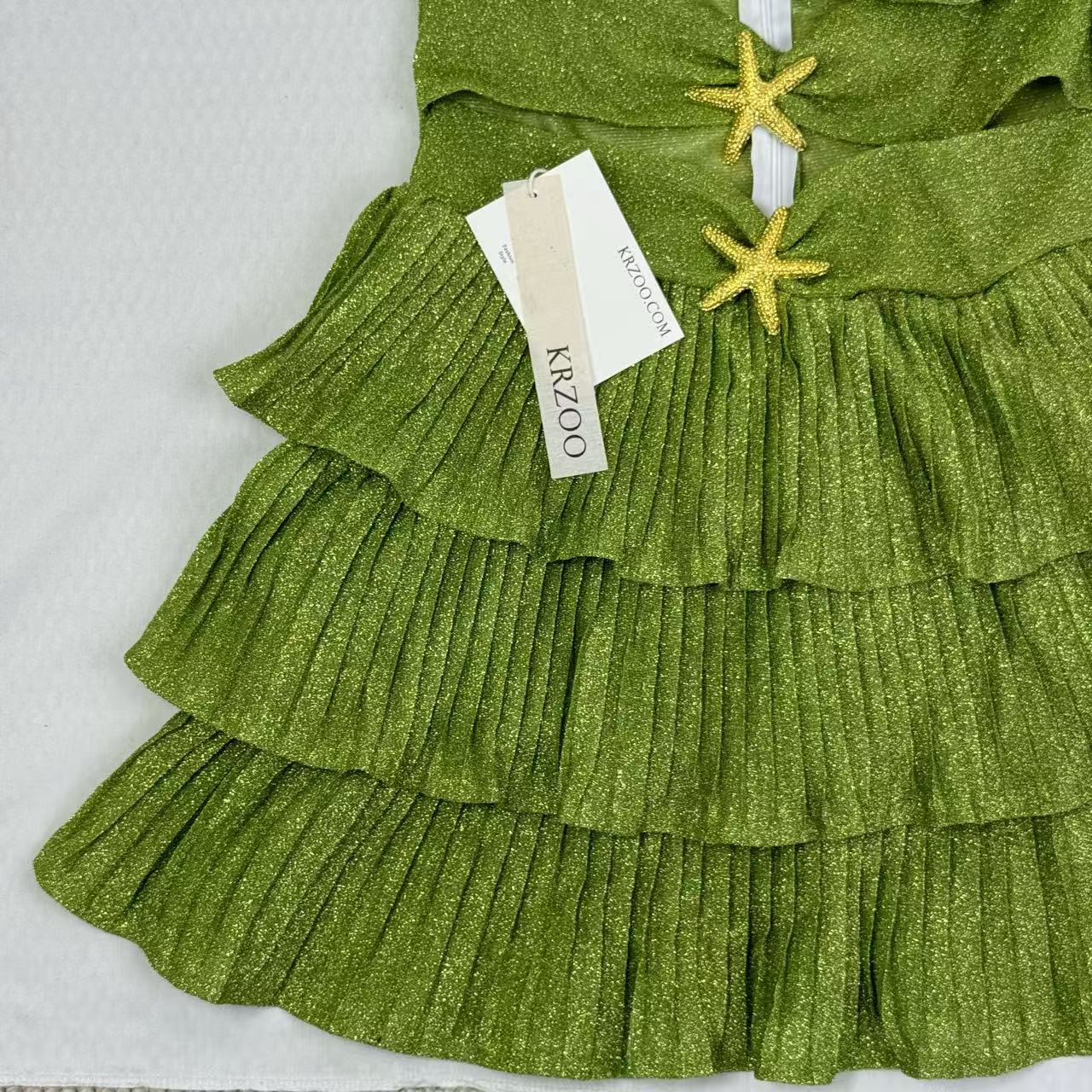 V-neck halter dress with sequins on the skirt