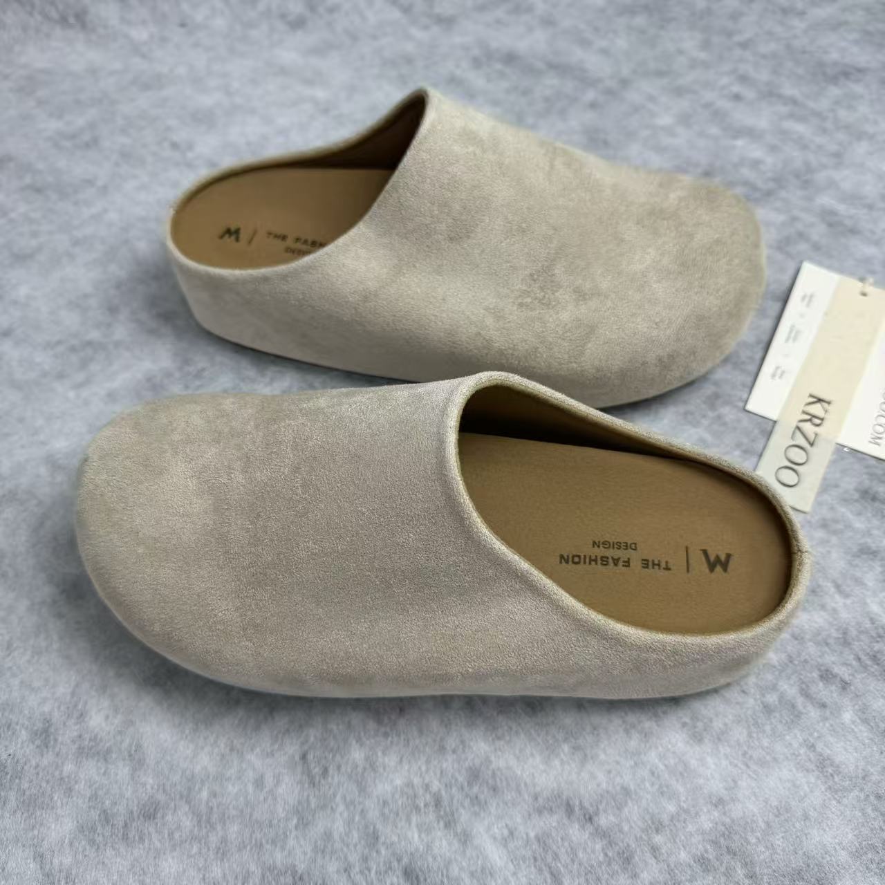 One foot wearing a thick-soled baghdad-style shoe