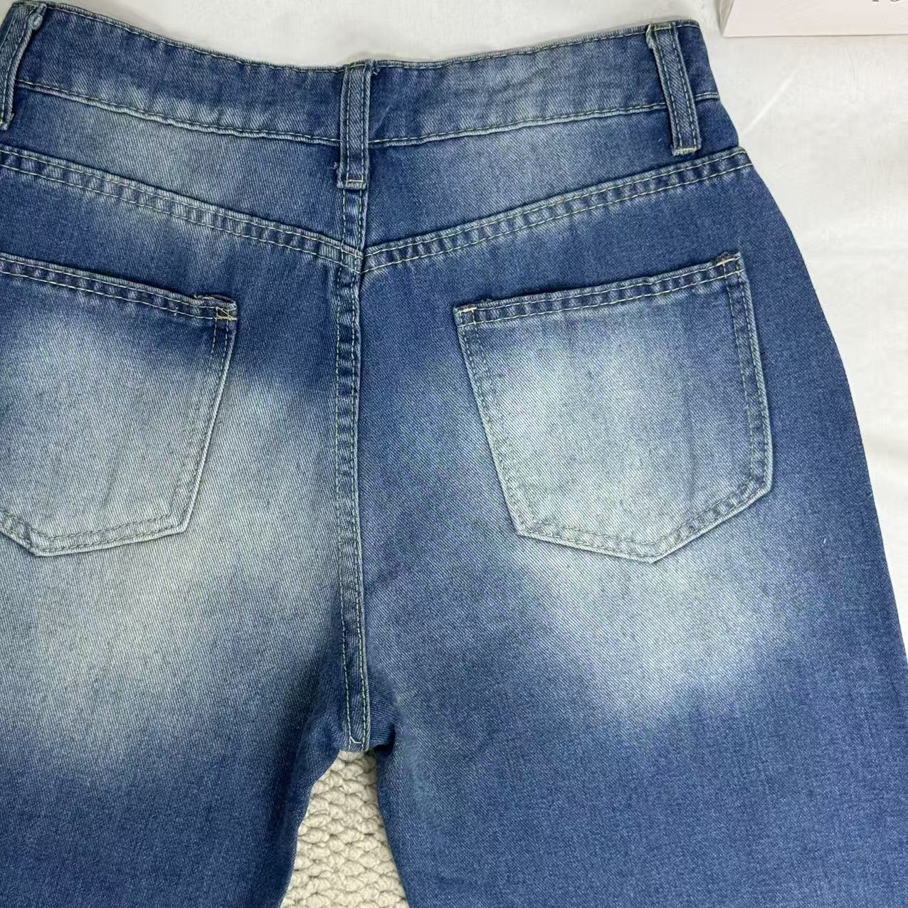 High-Waisted Ripped Jeans