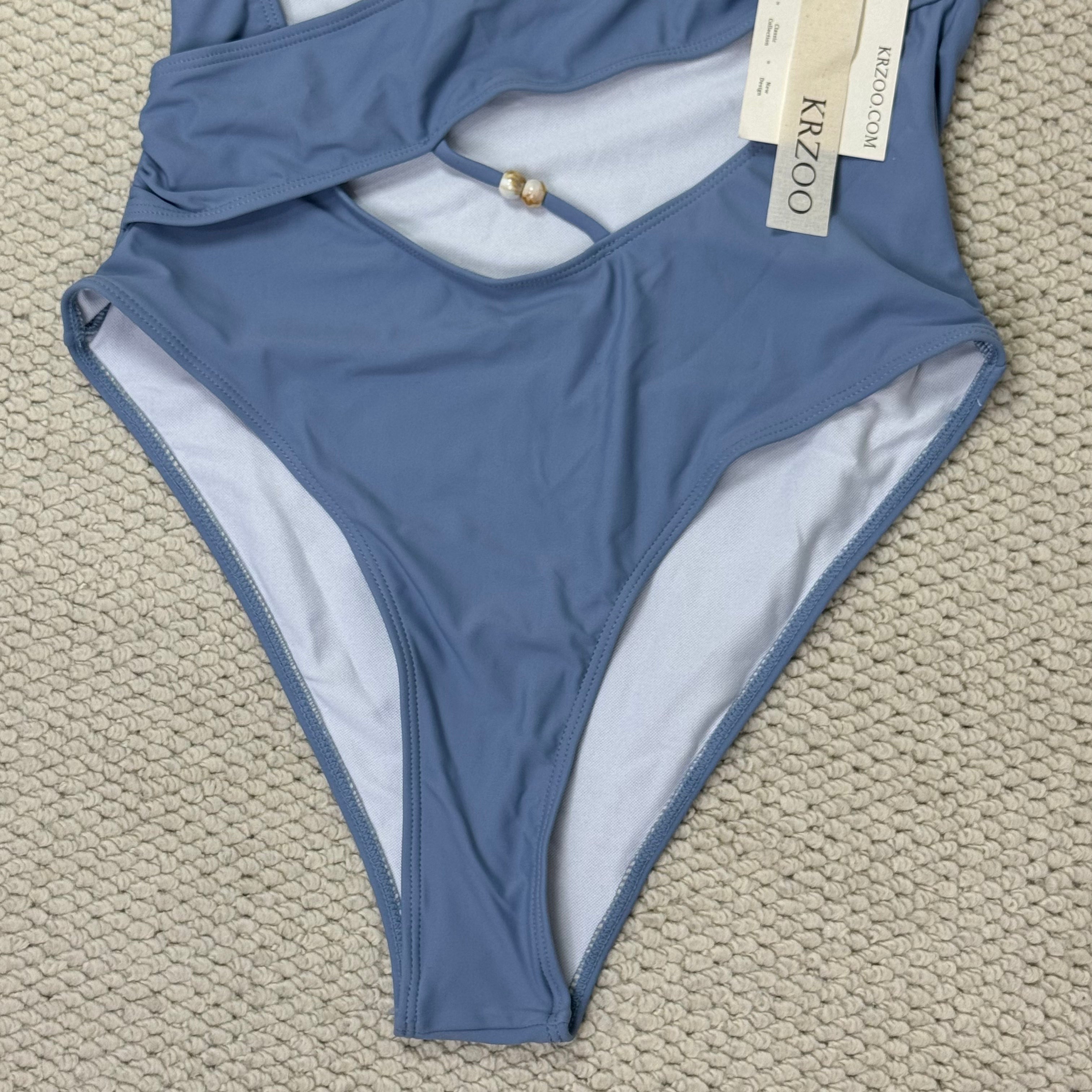 Solid-color irregularly perforated bikini