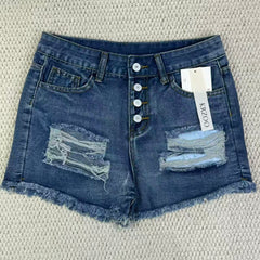 Hole-rimmed fringed denim shorts