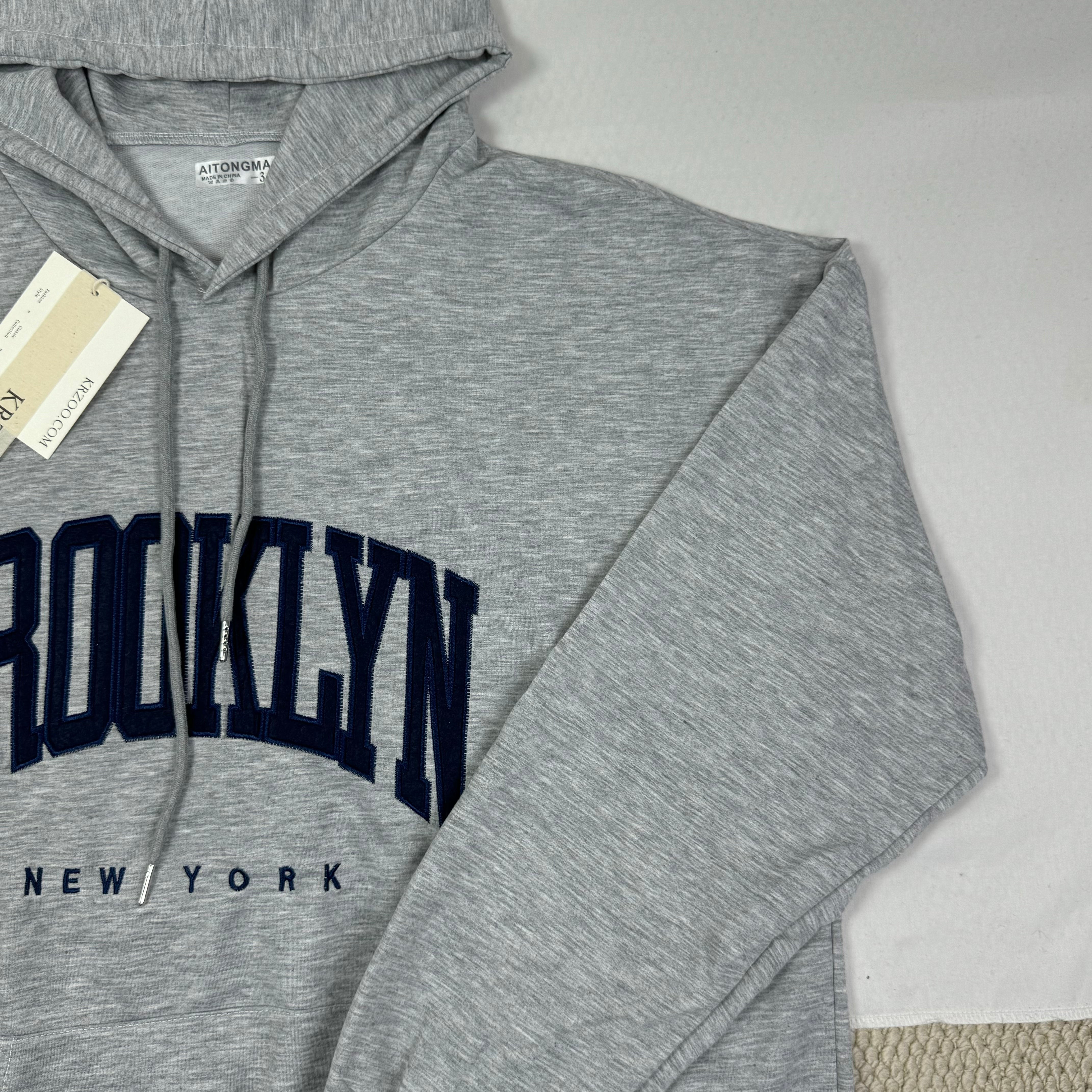 Hooded sweatshirt is loose