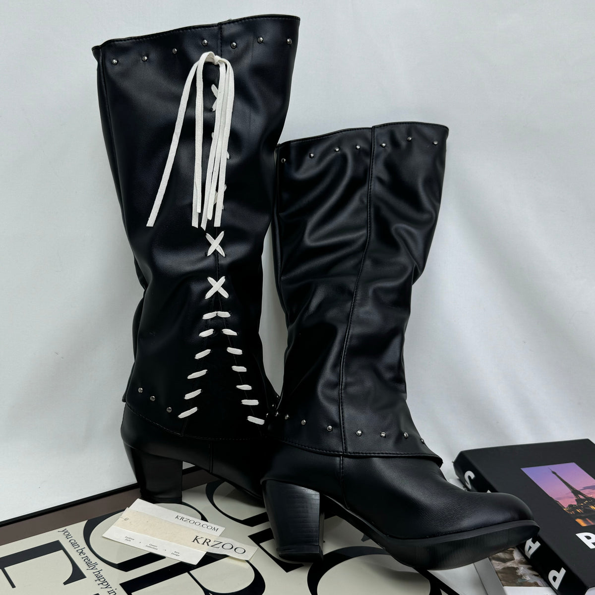 Tasseled long boots made of leather