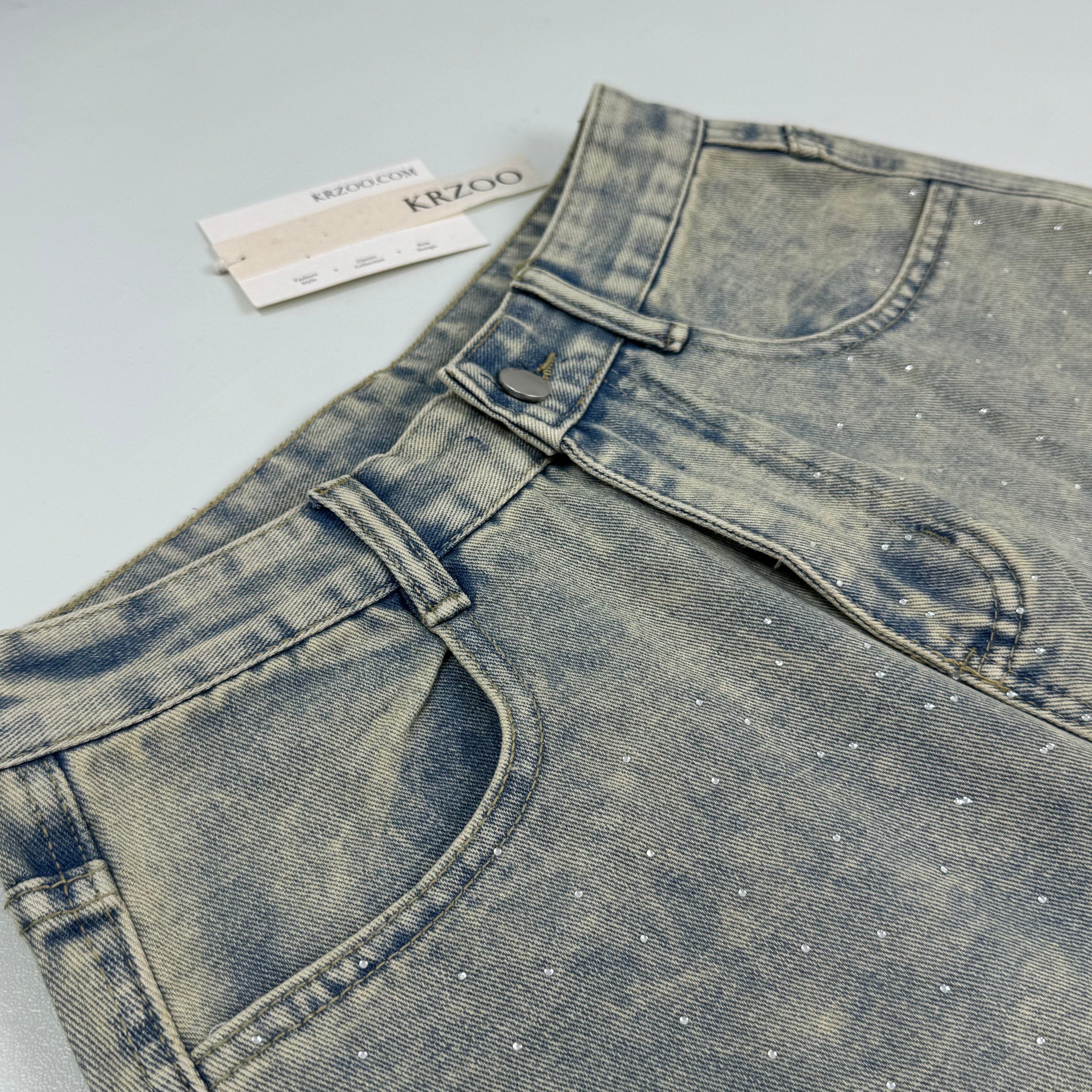 Washed letter-printed sequined denim pants