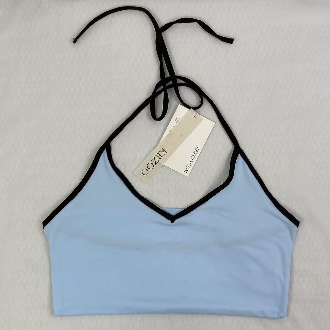 Contrasting color tie-neck sling-neck top