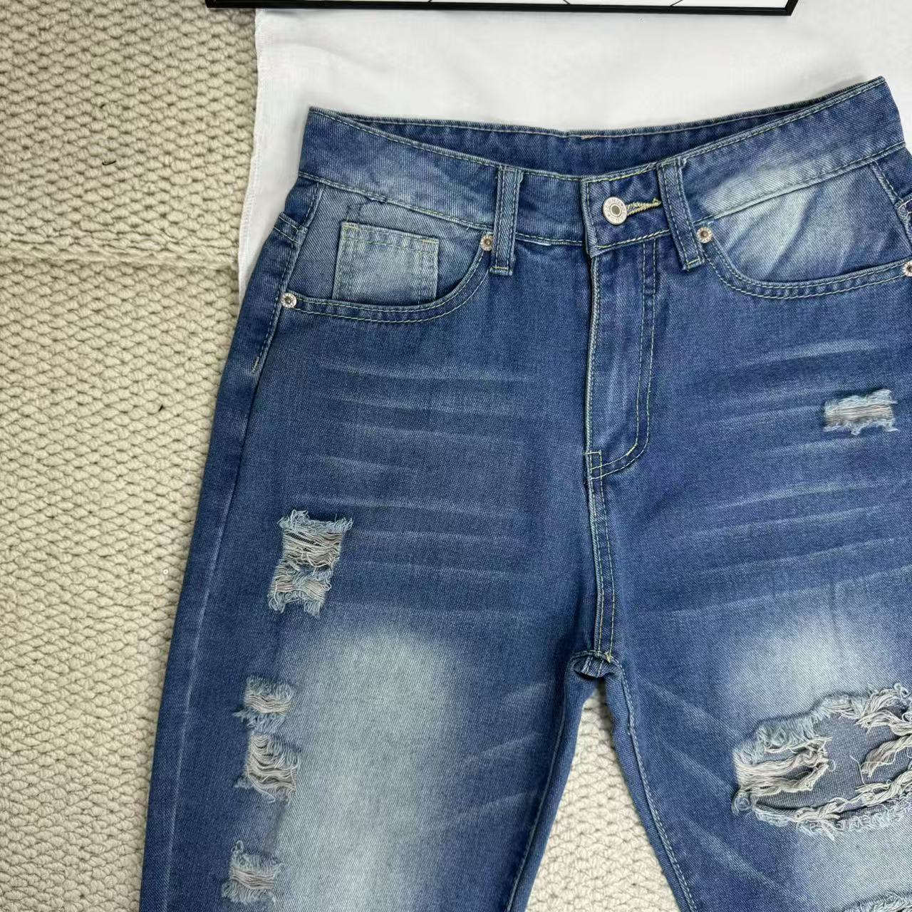 High-Waisted Ripped Jeans