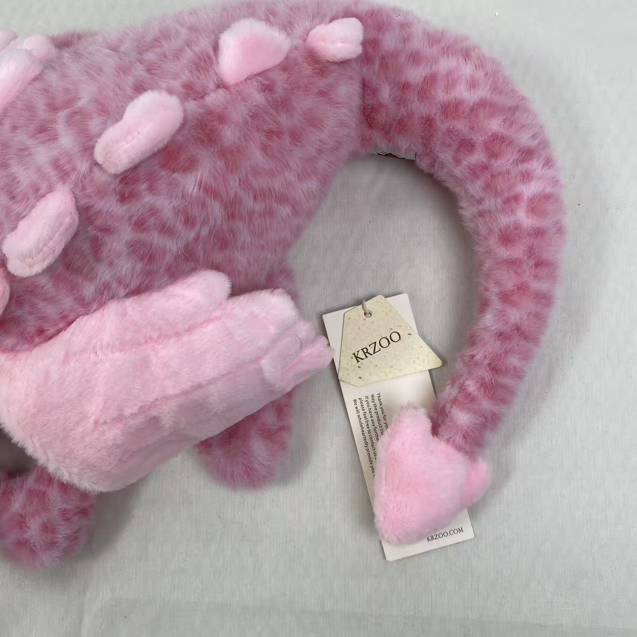 Pink little dragon doll