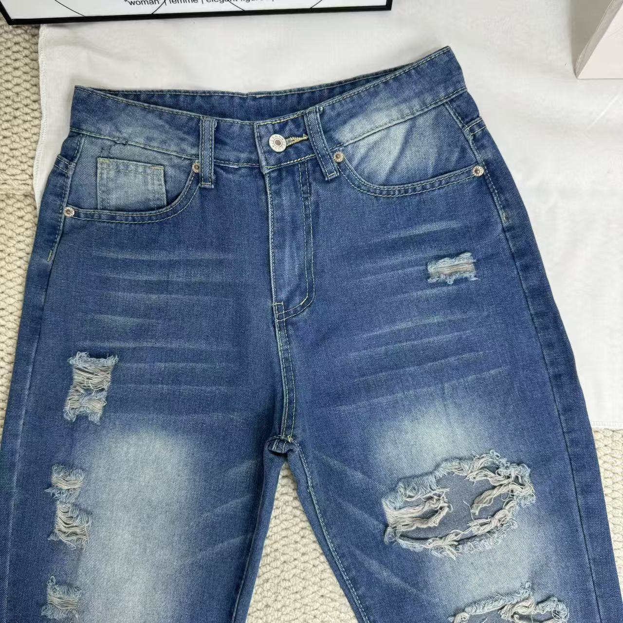 High-Waisted Ripped Jeans