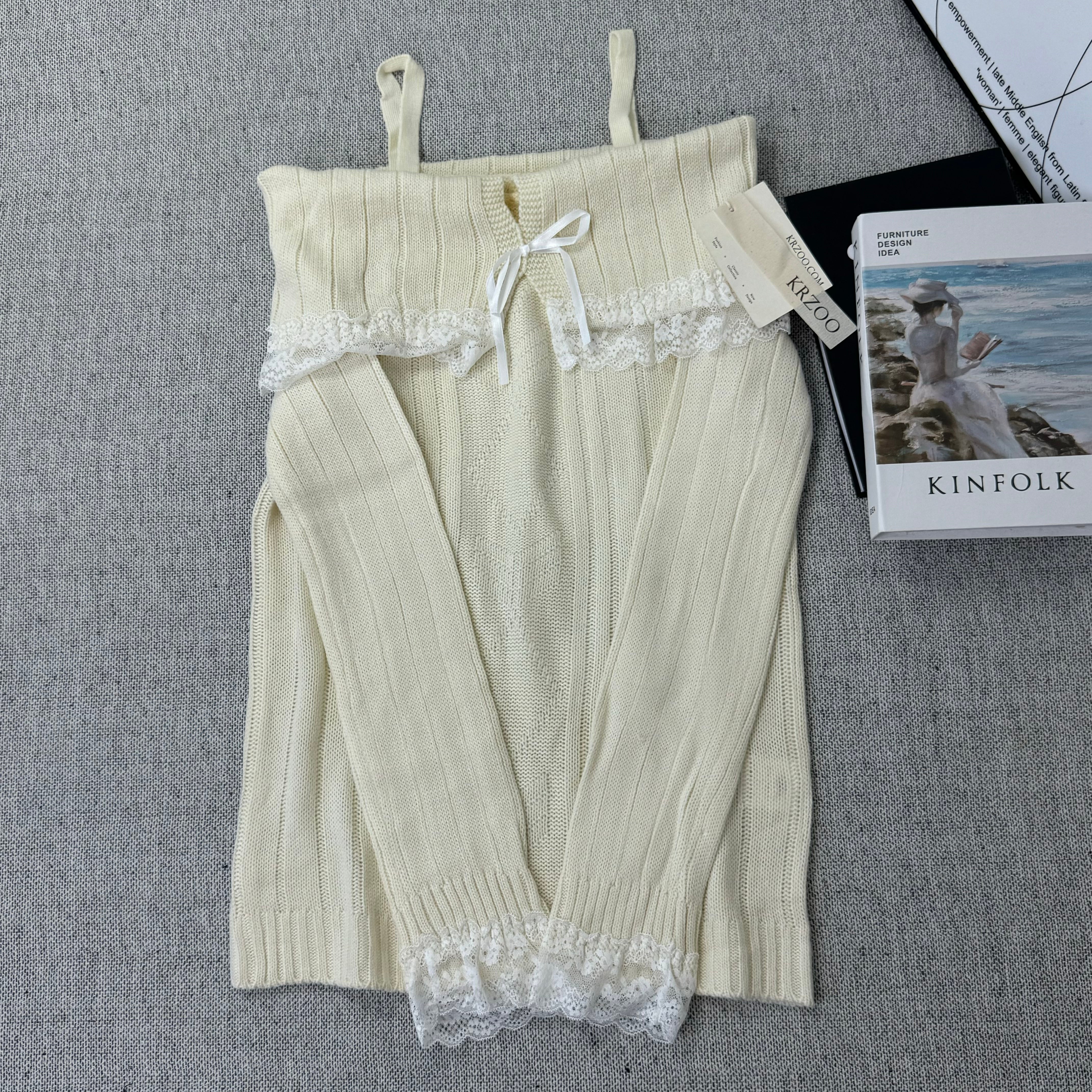 Lace trimmed one-shoulder sweater