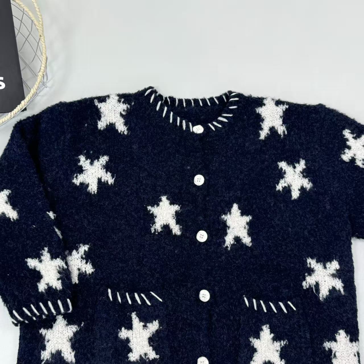 Dark blue star-patterned knitted sweater coat