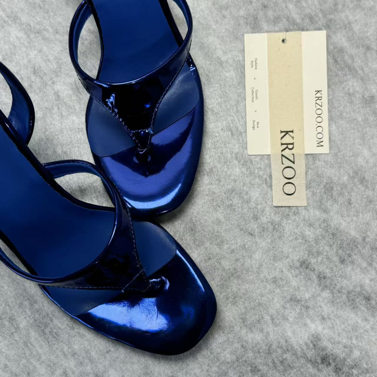A slip-on toeless open-toe Roman-style shoe
