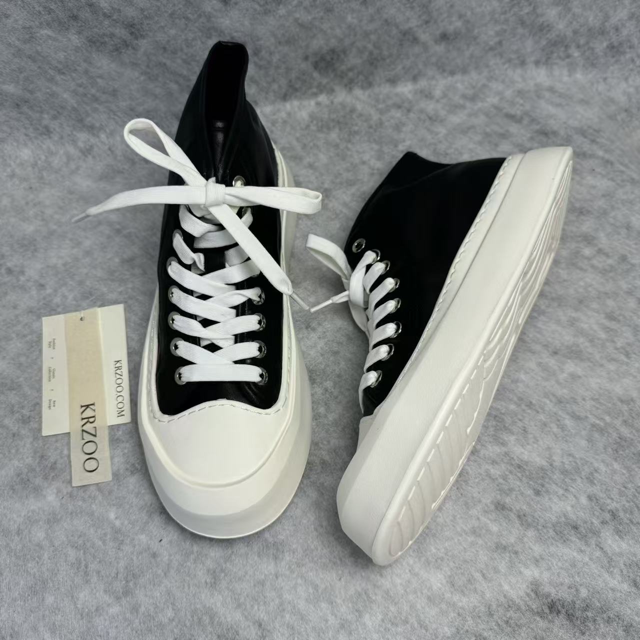 High-top black and white canvas shoes with thick soles