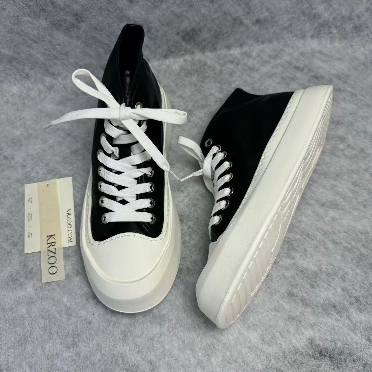 High-top black and white canvas shoes with thick soles