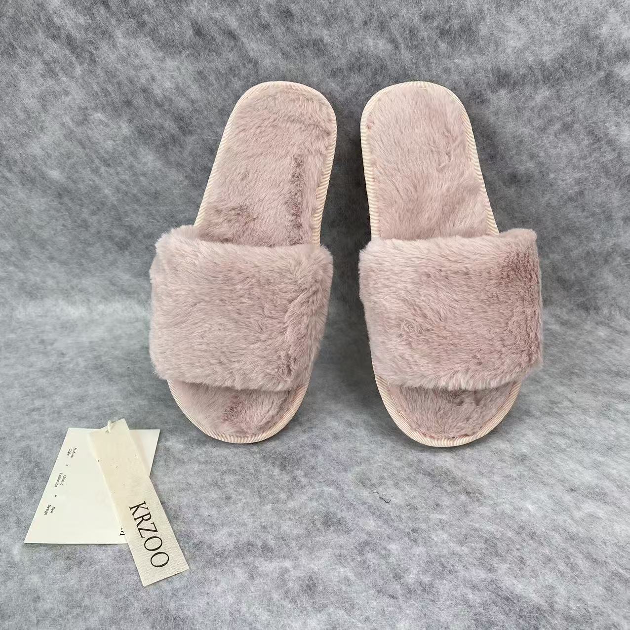 Soft plush slippers with short fur on the sole