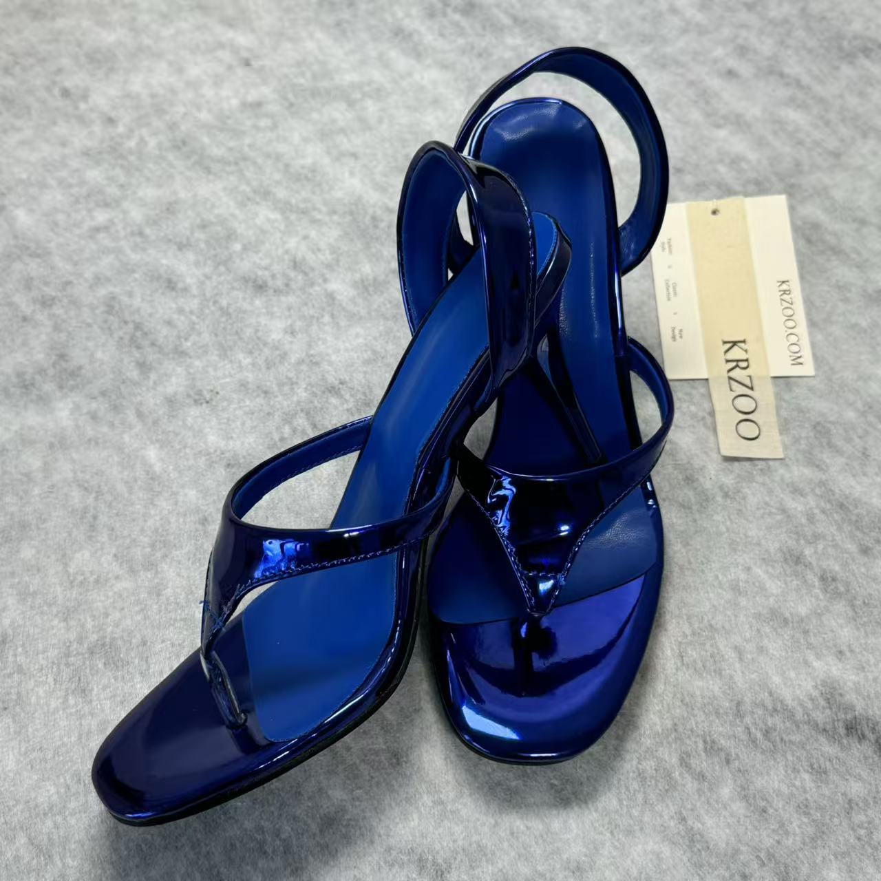 A slip-on toeless open-toe Roman-style shoe