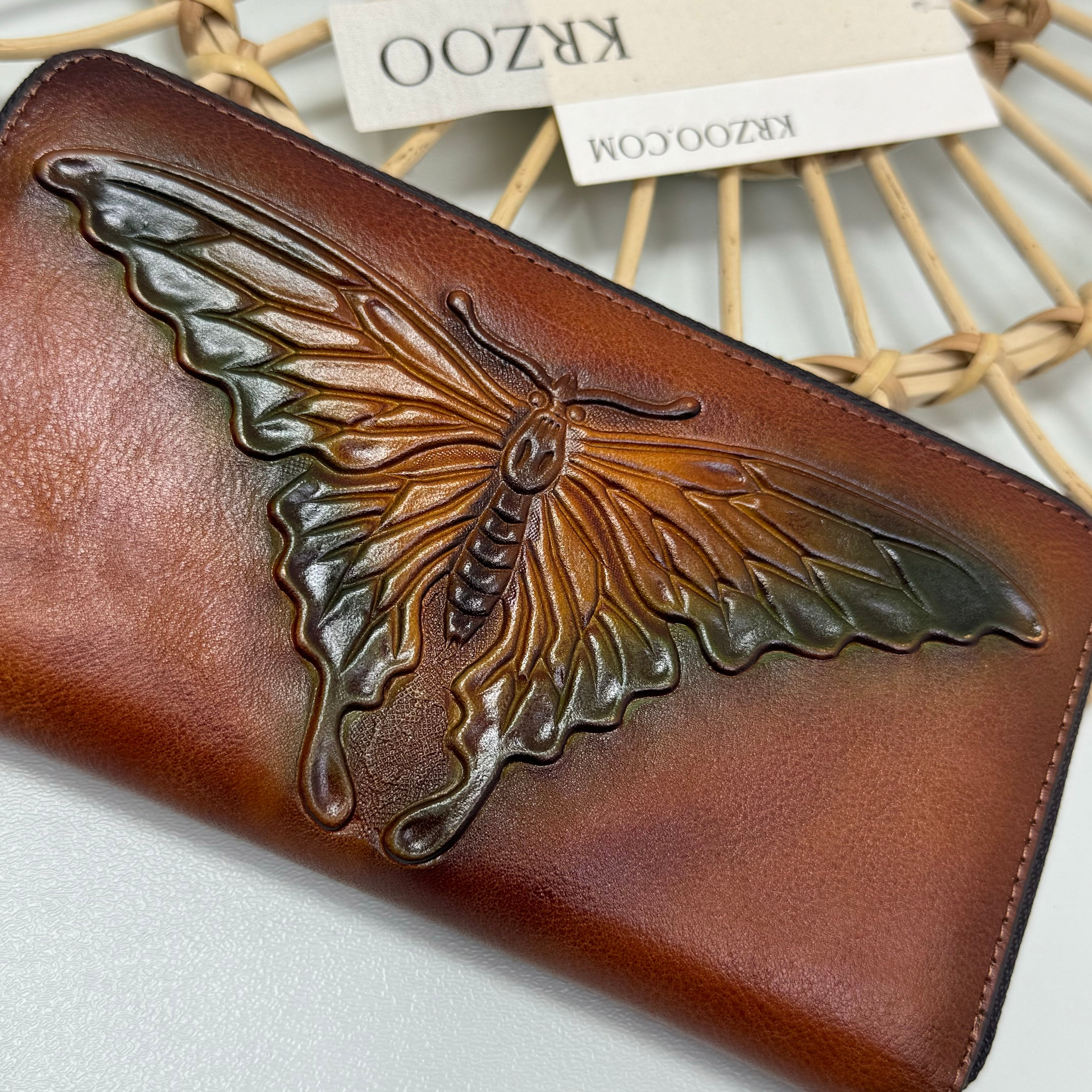 Butterfly embossed leather wallet