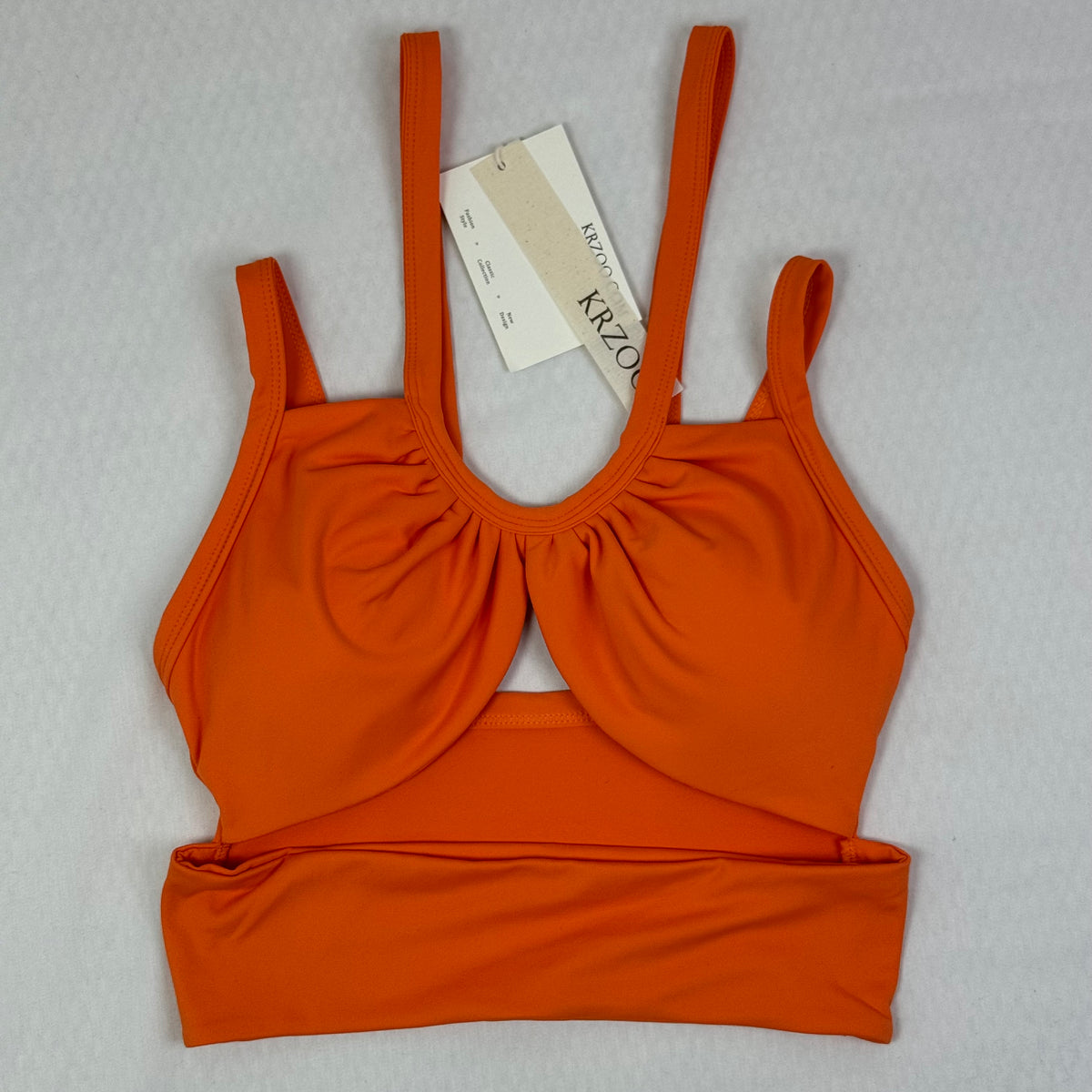 Open-necked top with a draped collar