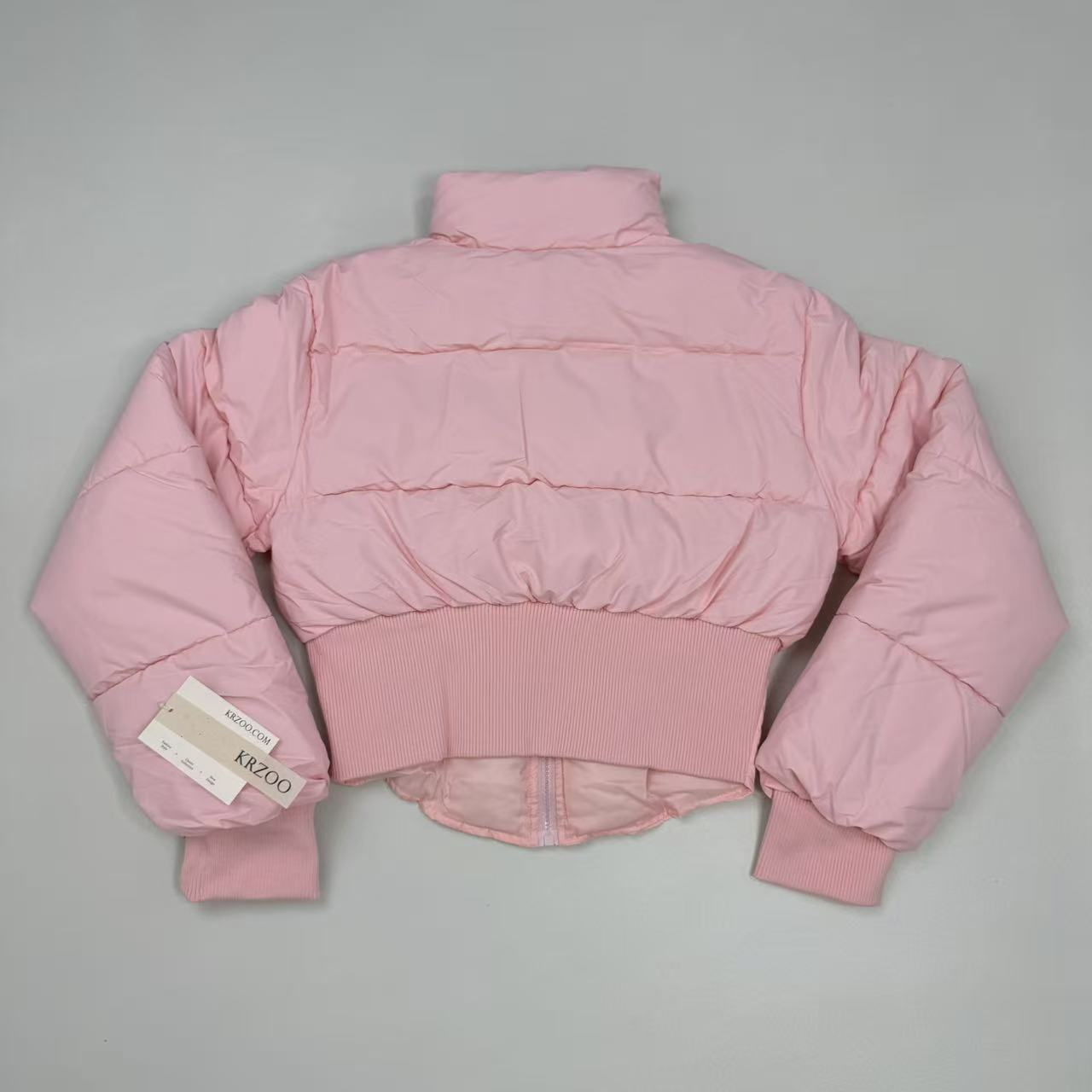A slim-fitting short coat with a stand-up collar